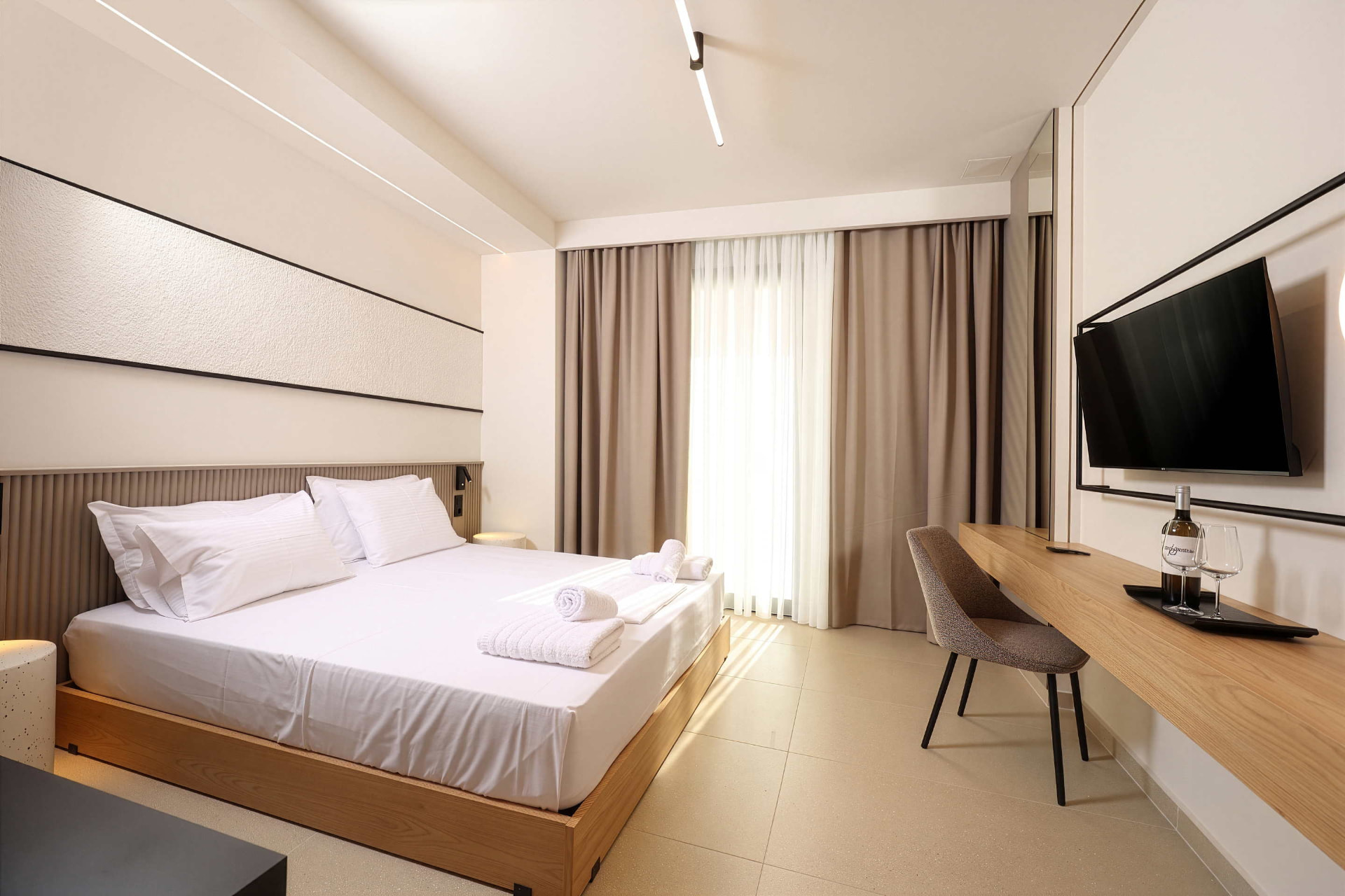 King Studio with king-size bed, fluted headboard and warm natural light