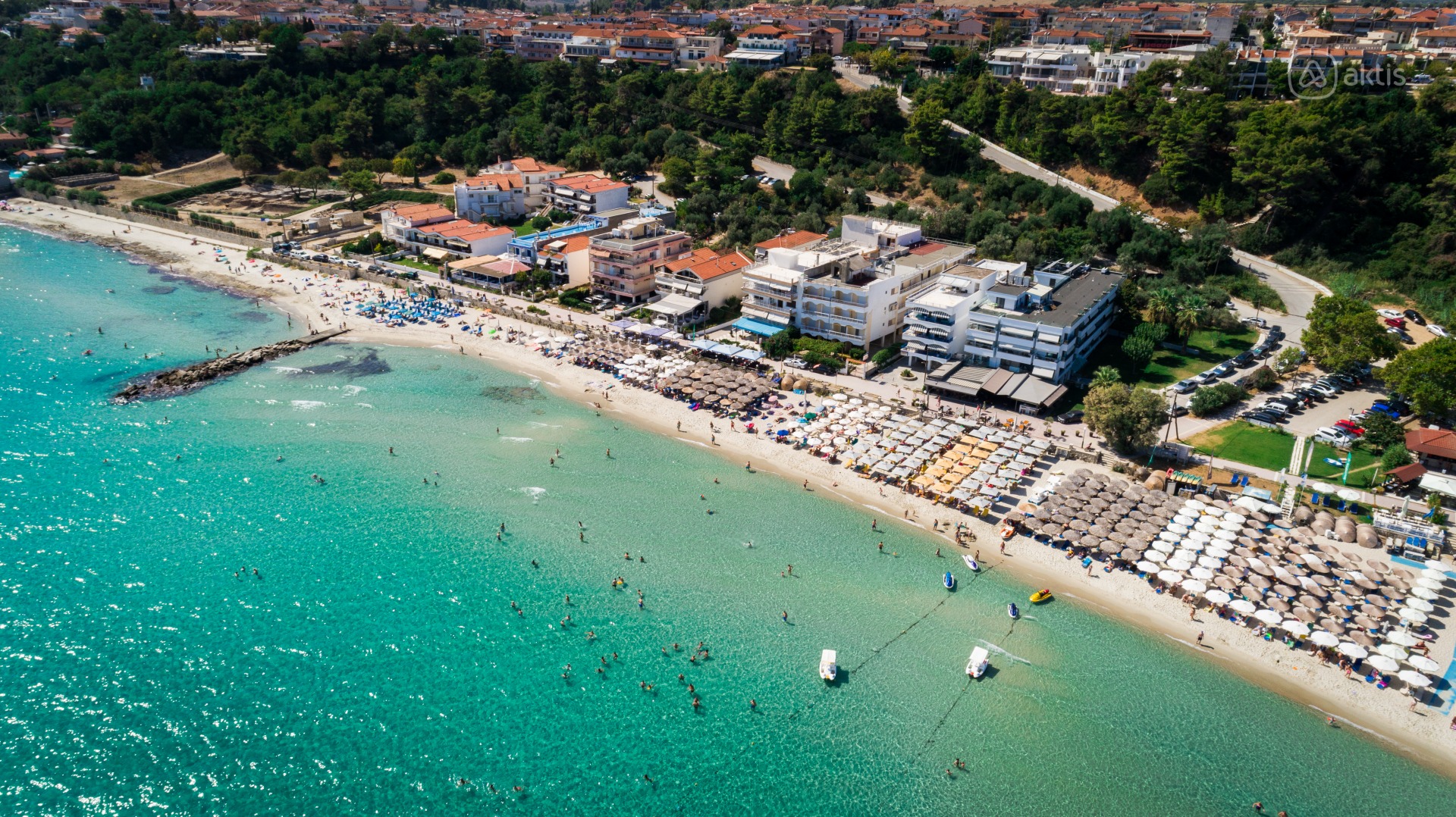Aerial view of Kallithea Beach with turquoise water and the town along the shore